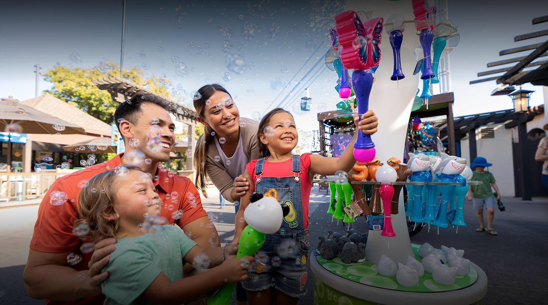 Family looking at bubble wands. 